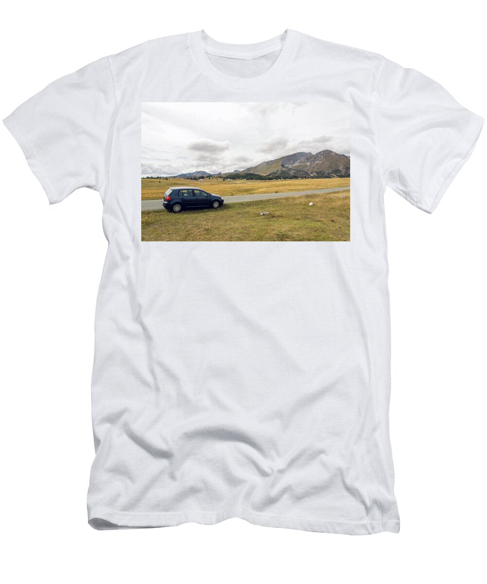 1 Car with the Traveler Stands on the Roadside in a Yellow Field in Zabljak in Montenegro Elena Saulich T-Shirt