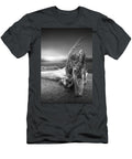 Black and White Photograph of Driftwood on the Beach Randall Nyhof T-Shirt