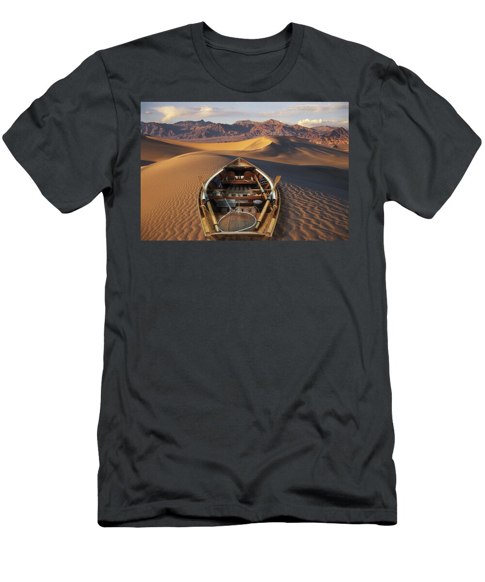 Drift Boat Resting on Sand Dunes in Ron Sanford T-Shirt