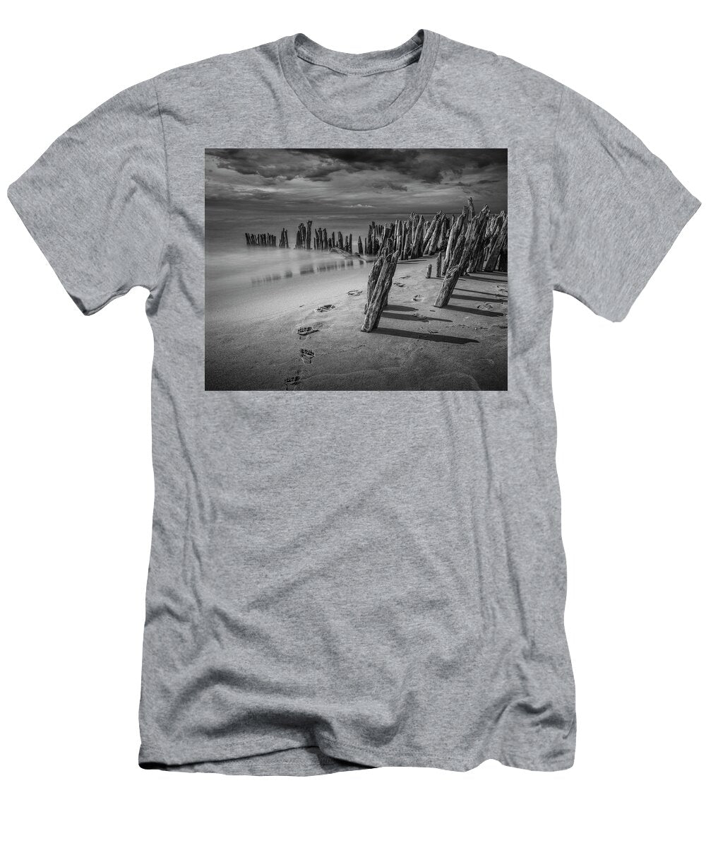 Footprints and Pilings on the Beach in Black and White Randall Nyhof T-Shirt