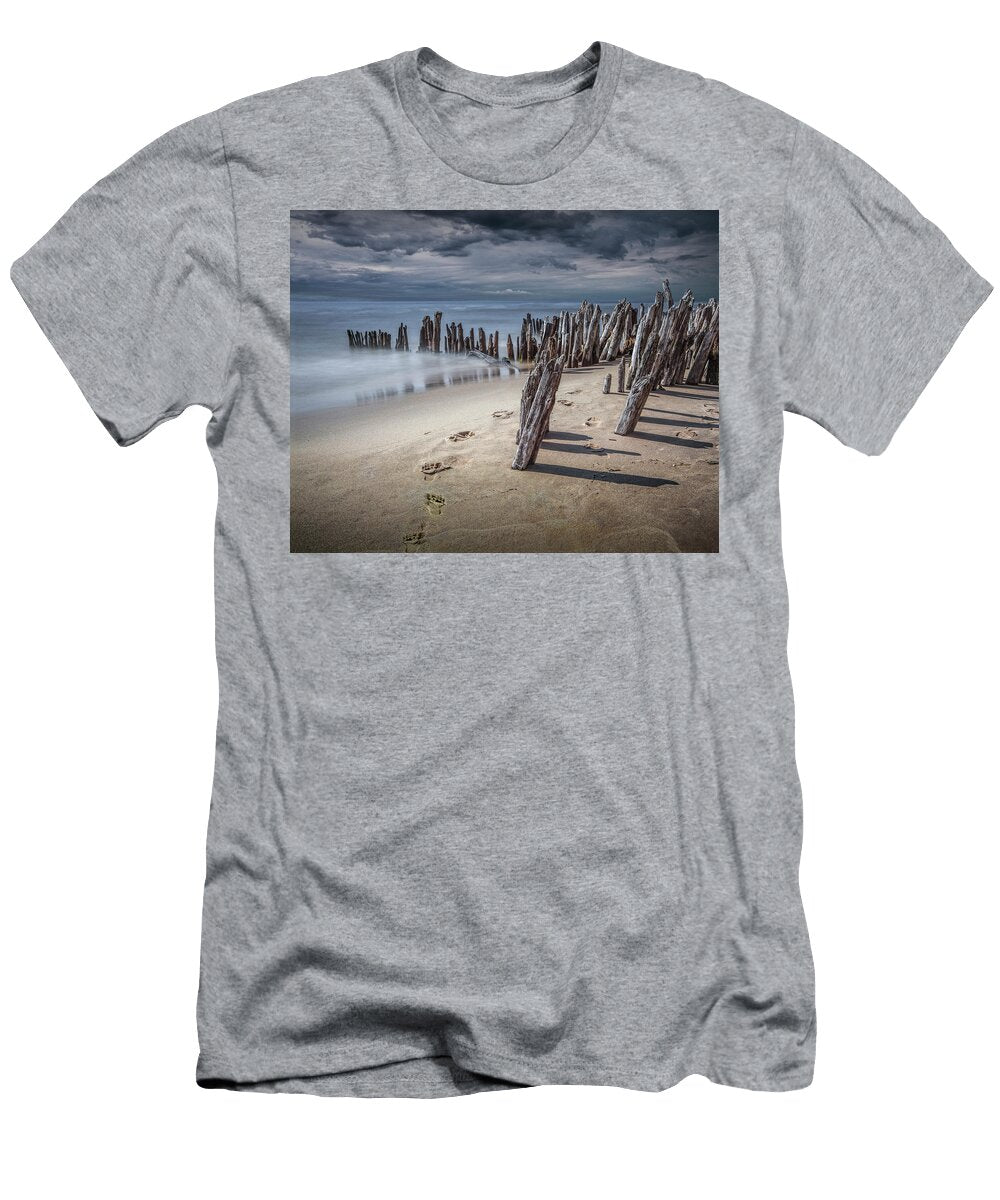 Footprints and Pilings on the Beach Randall Nyhof T-Shirt