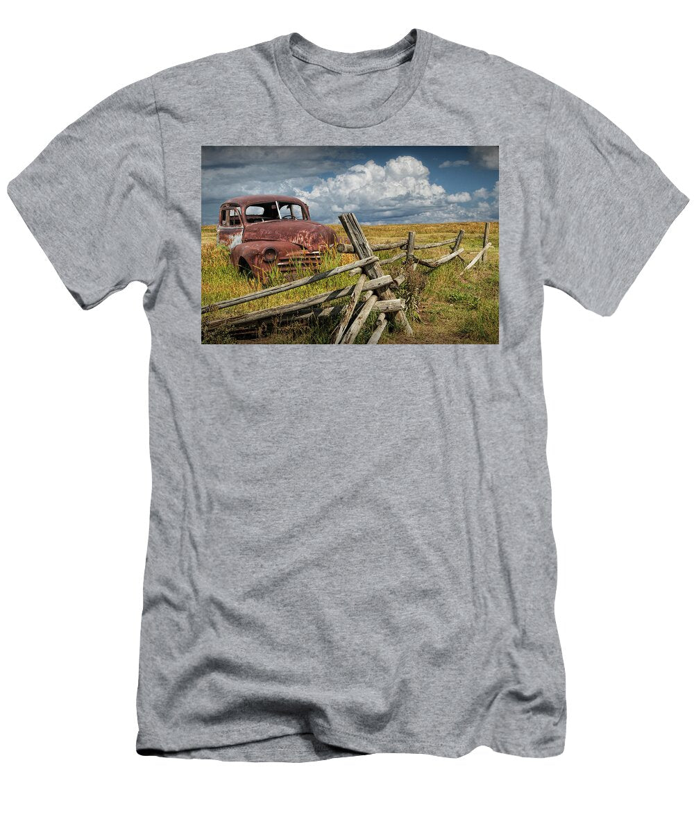 Rusted Vintage Automobile in a Rural Landscape Behind Old Wooden Log Fence Randall Nyhof T-Shirt